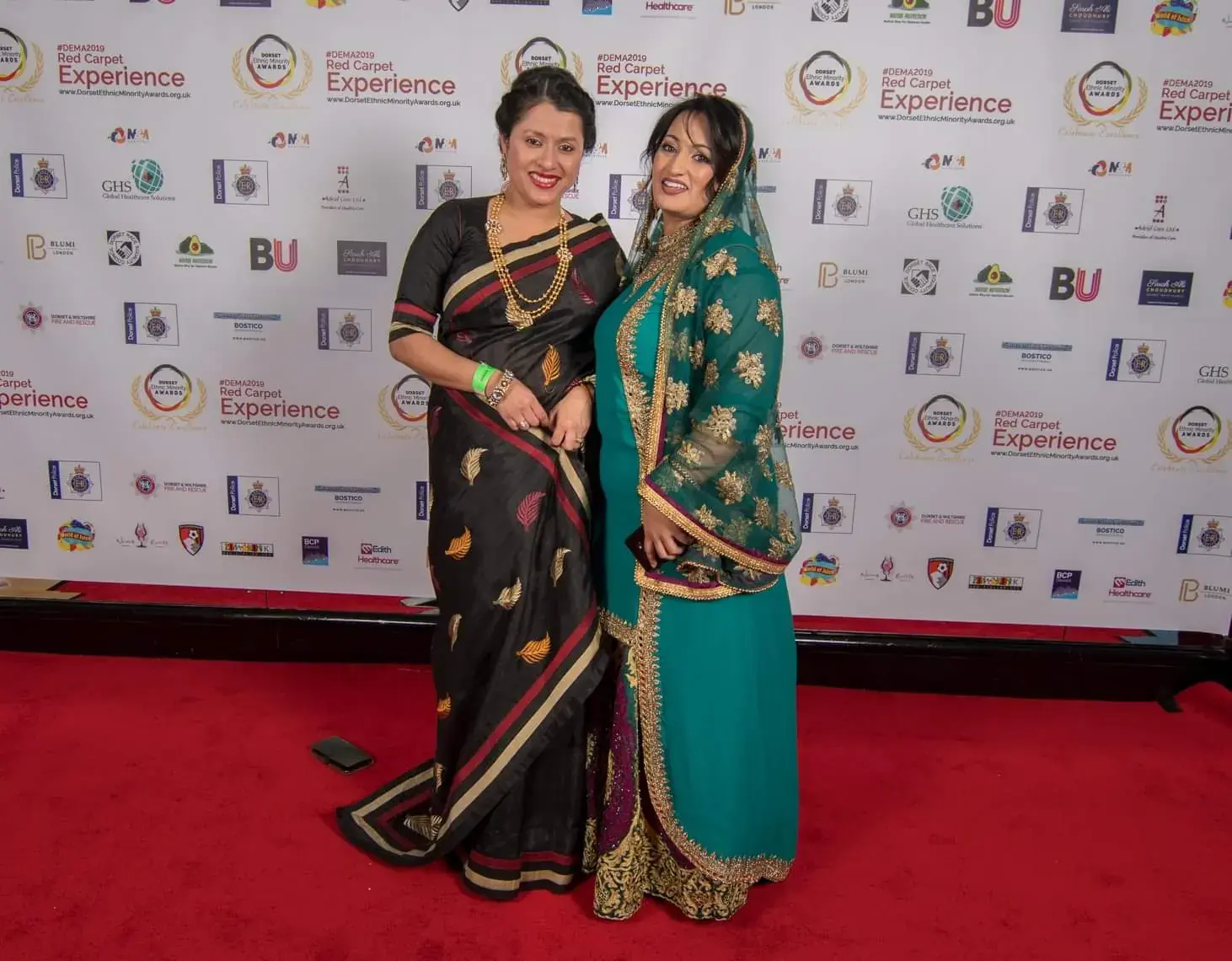 Two guests in traditional saris on the Red Carpet Experience